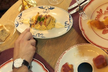 a person eating food at a table