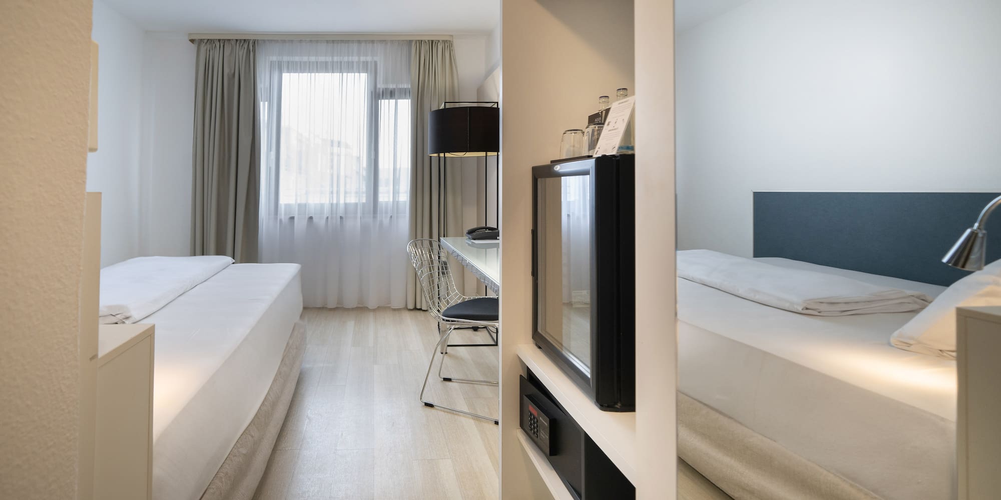 a room with a tv and a bed