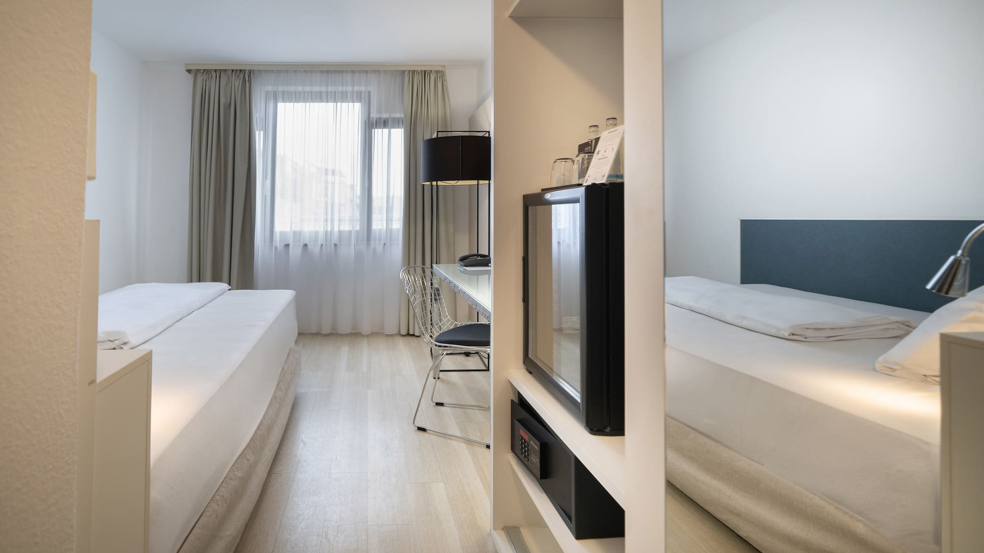 a room with a tv and a bed