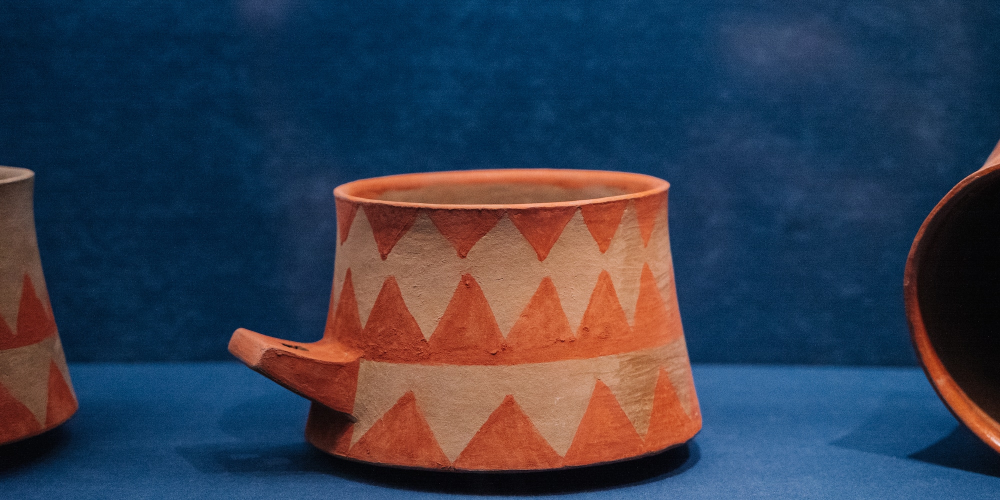 a cup on a blue surface