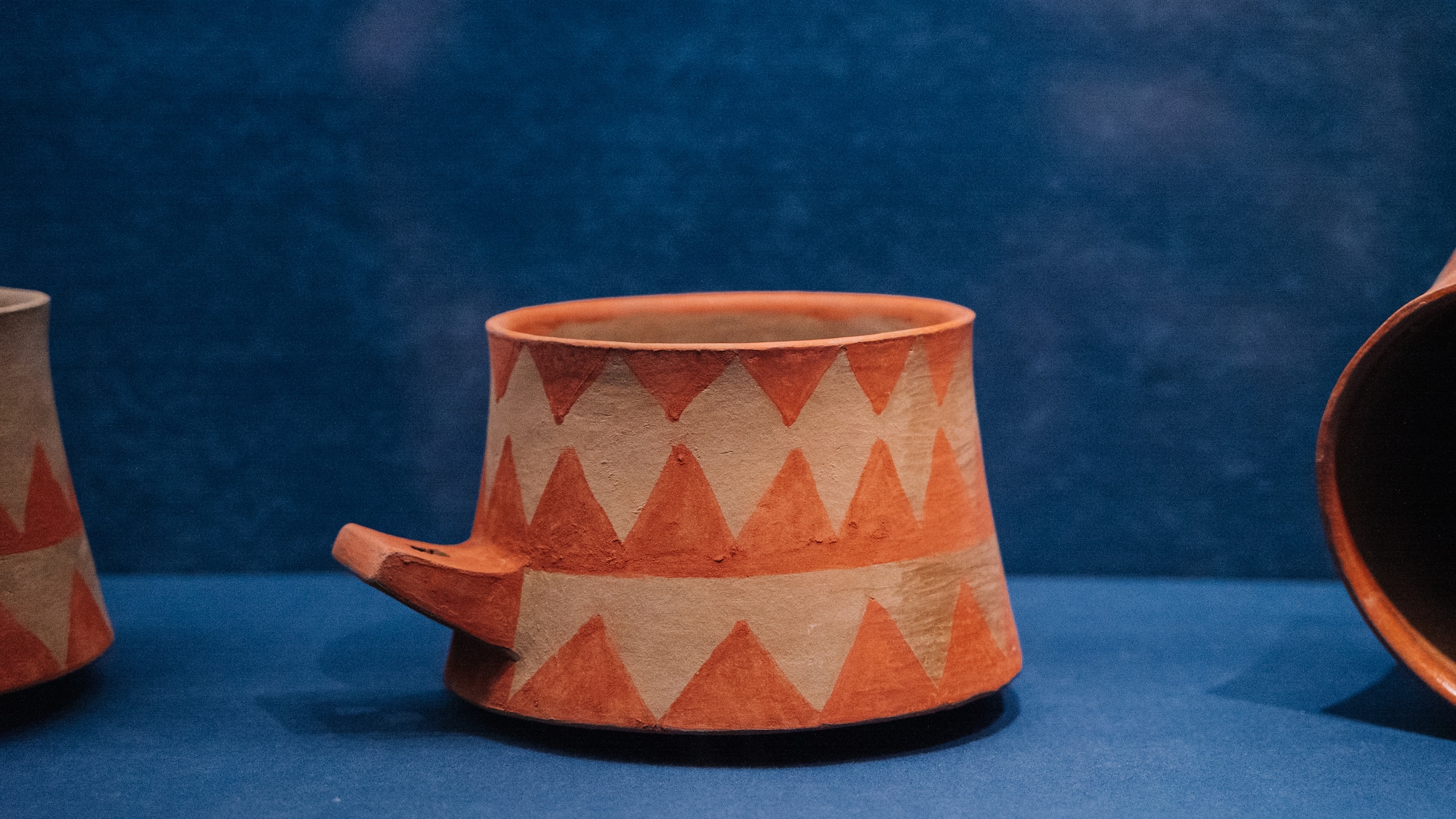 a cup on a blue surface