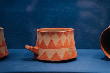 a cup on a blue surface