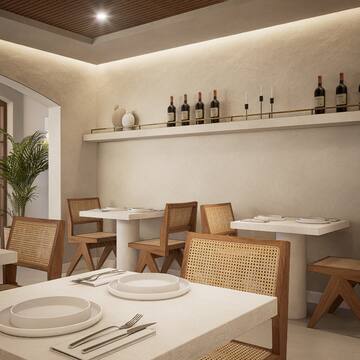 a room with white tables and chairs