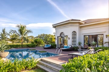 a pool in front of a house