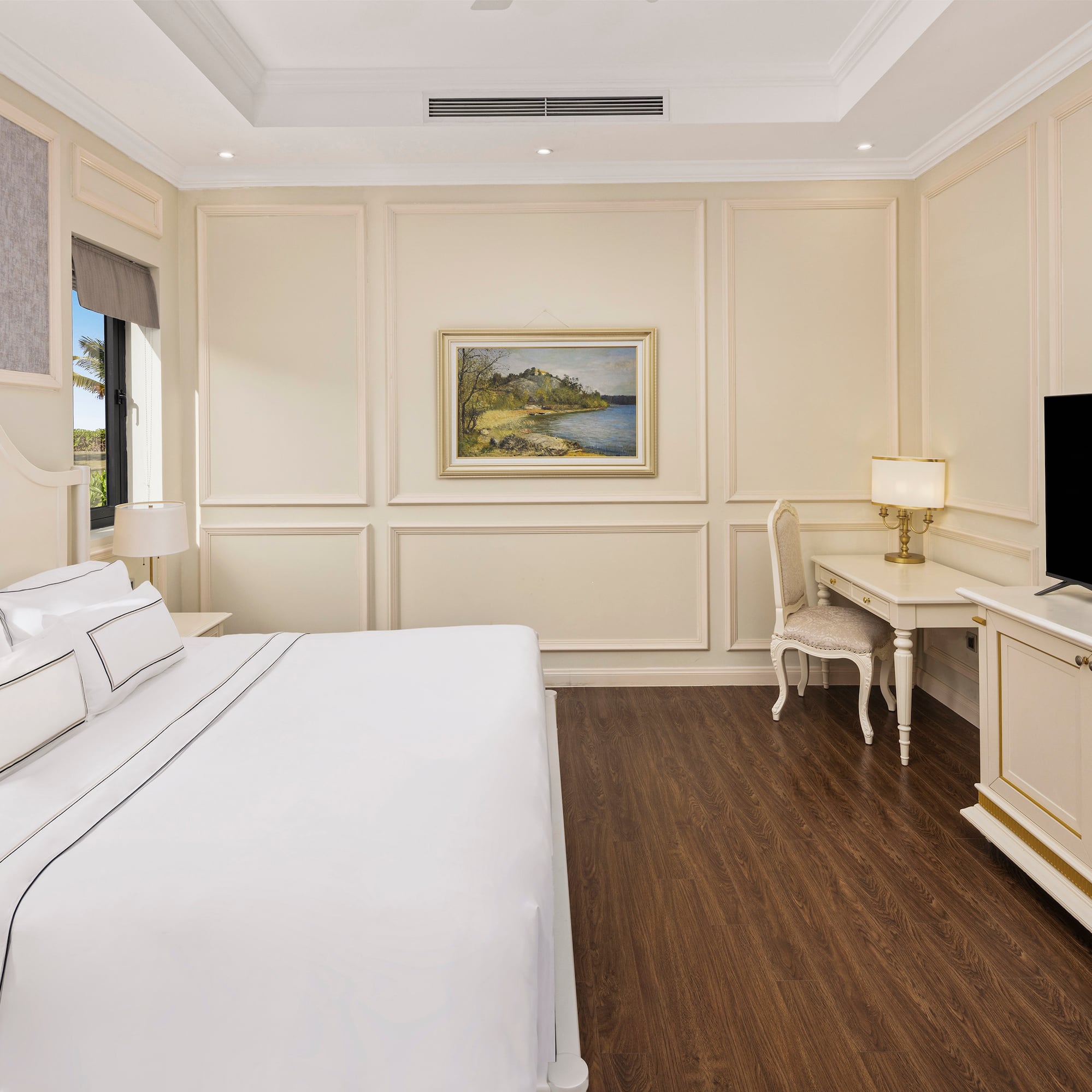 a bedroom with a bed and a television