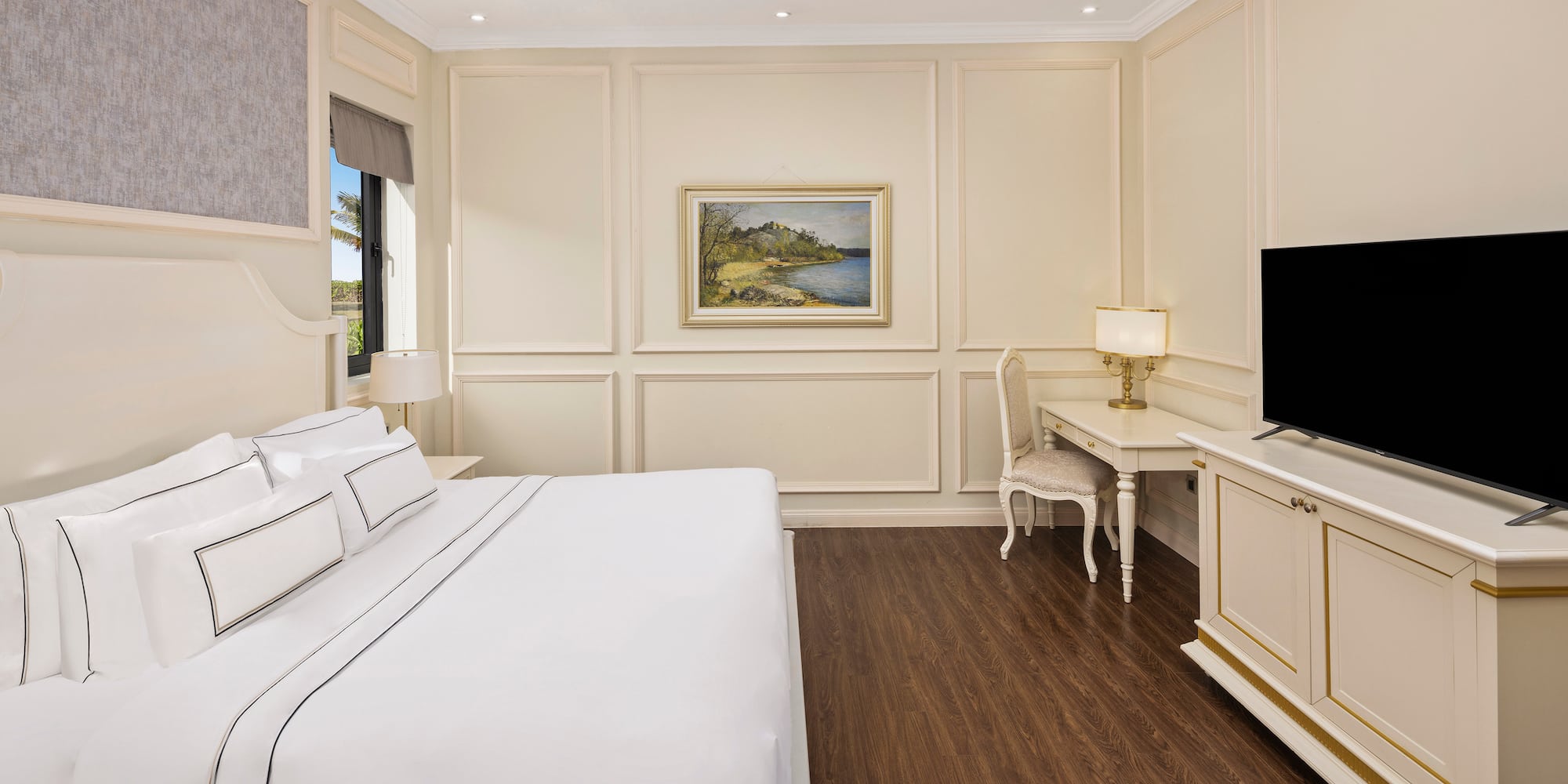 a bedroom with a bed and a television