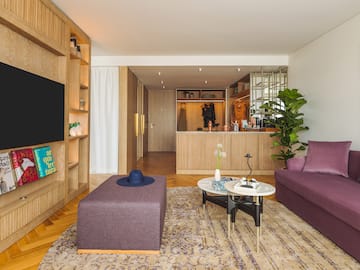 a living room with a couch and a tv