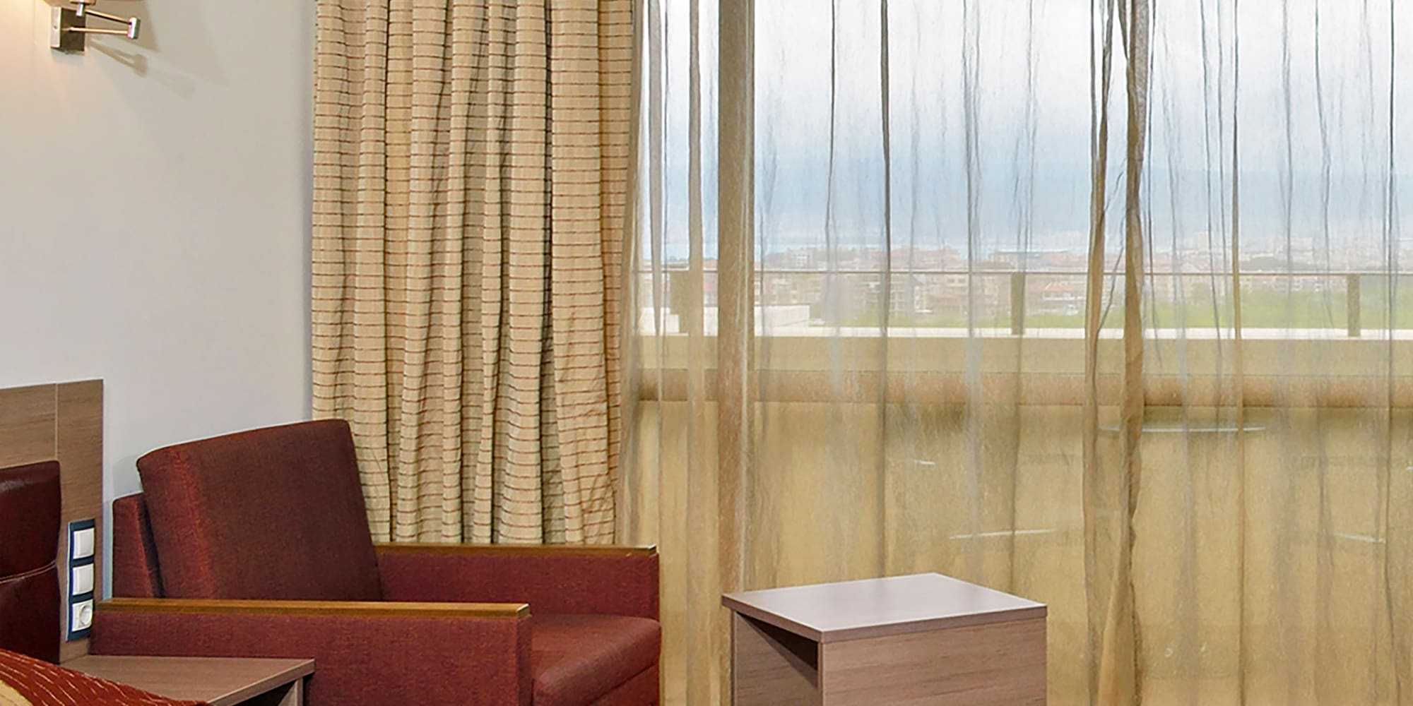 a room with a bed and a chair