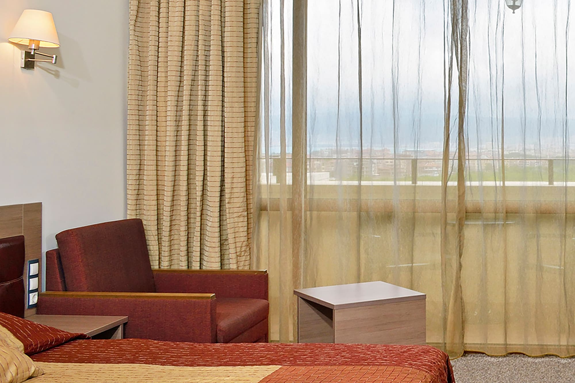 a room with a bed and a chair