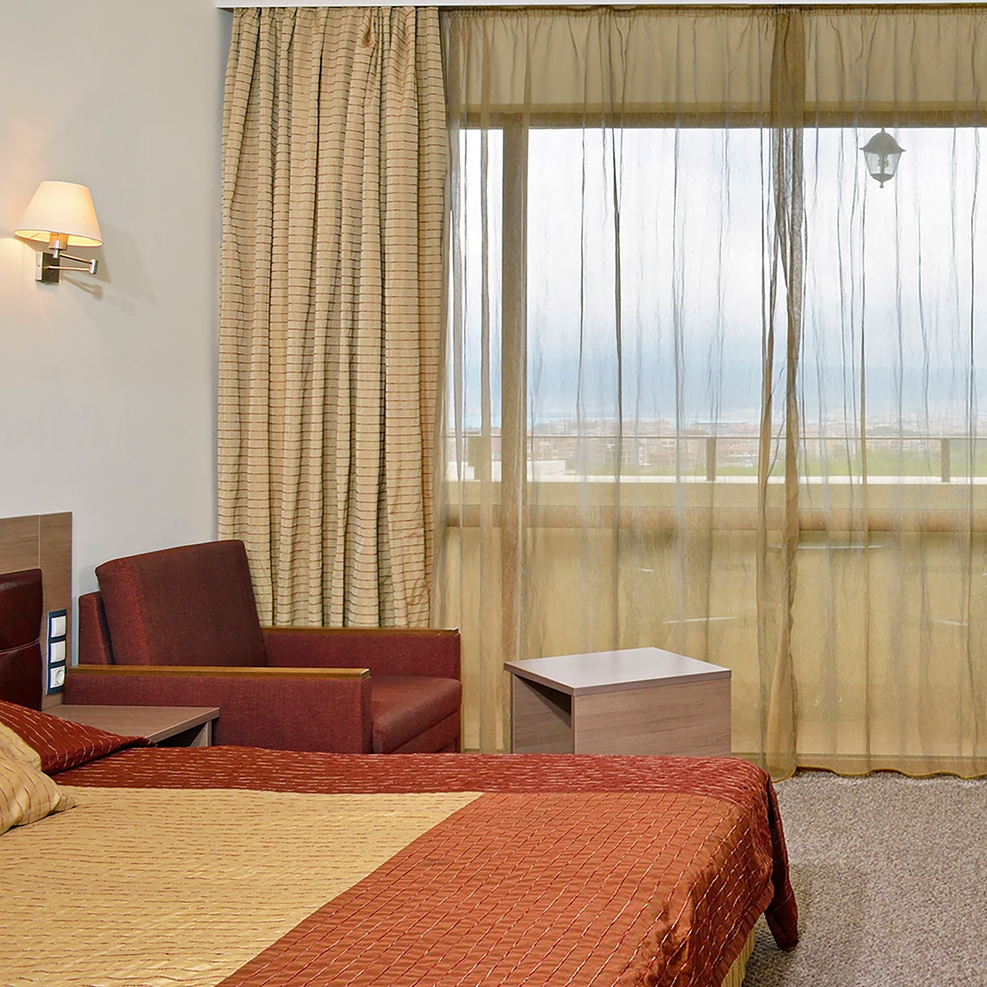 a room with a bed and a chair