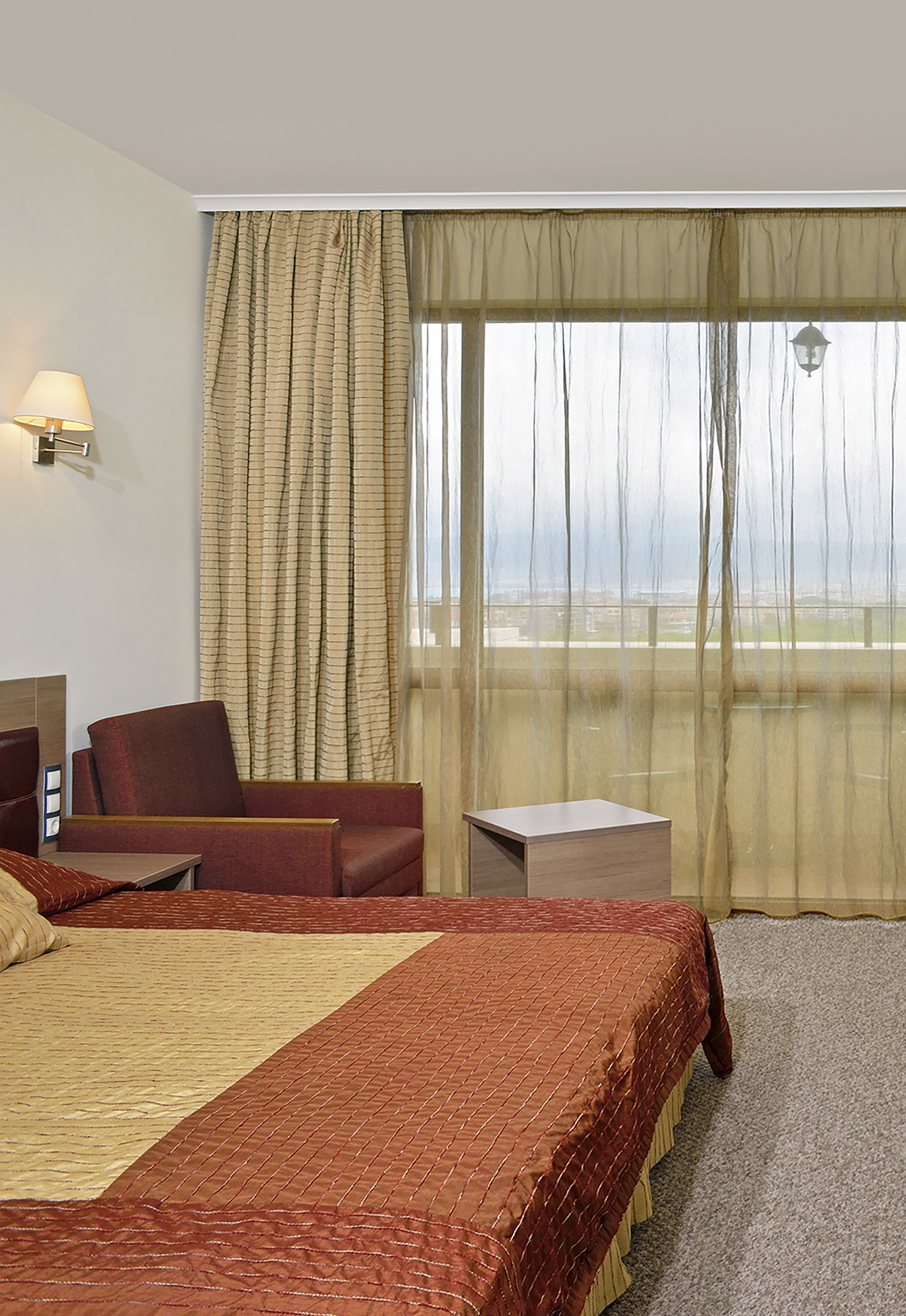 a room with a bed and a chair