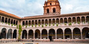 a building with a dome and a stone courtyard