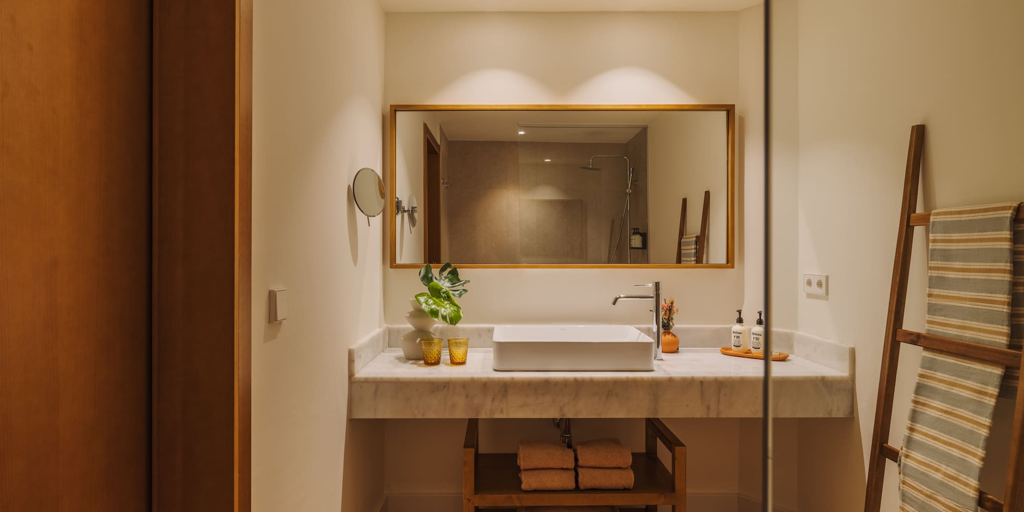 a bathroom with a mirror and sink
