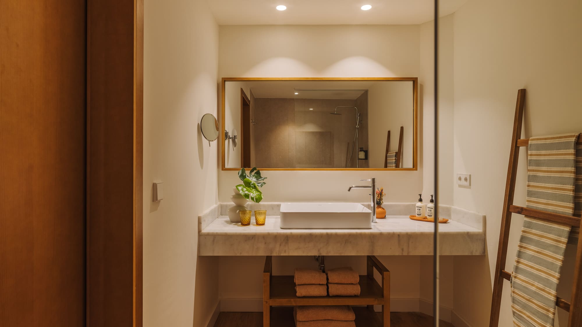 a bathroom with a mirror and sink