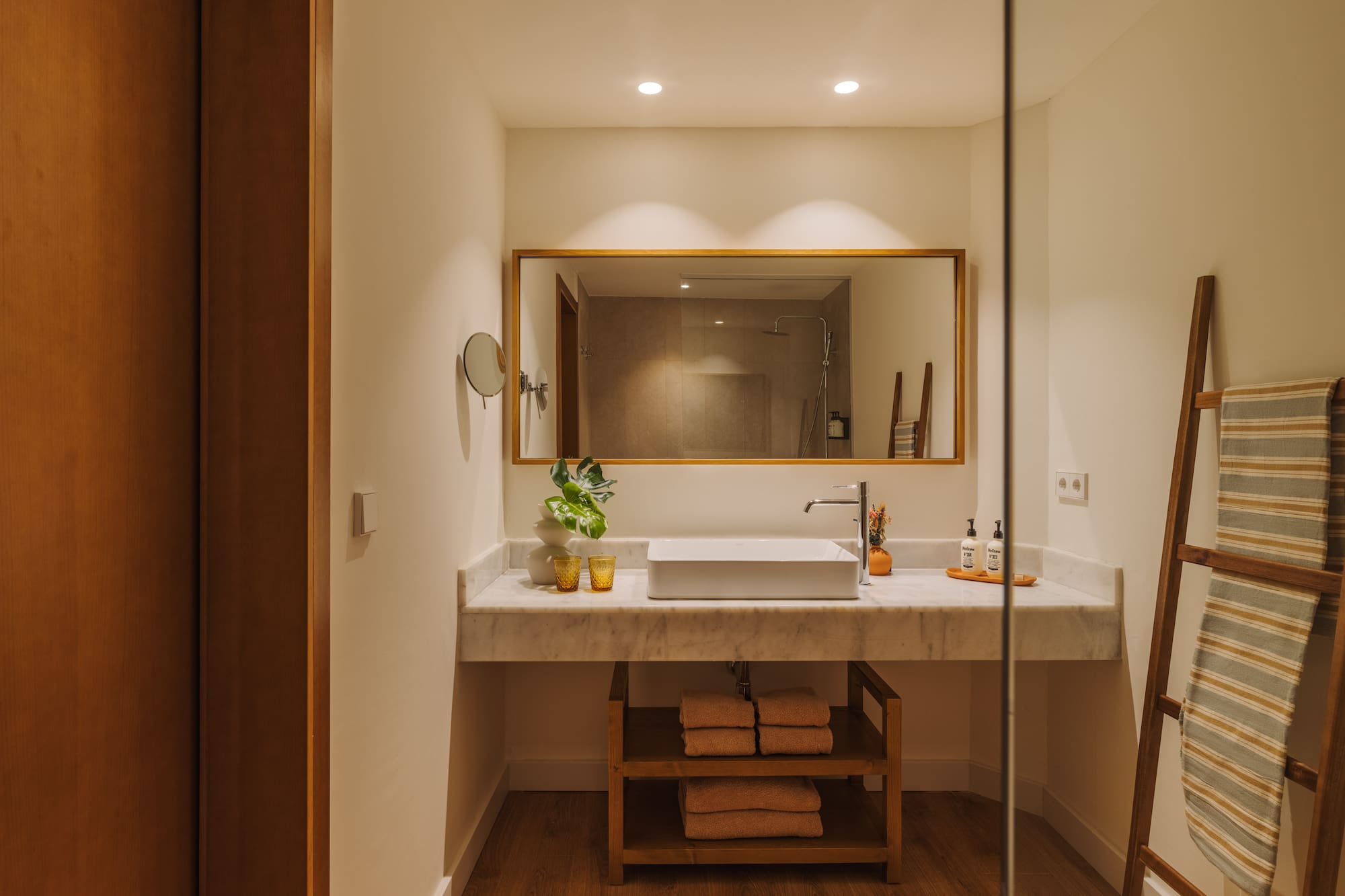 a bathroom with a mirror and sink