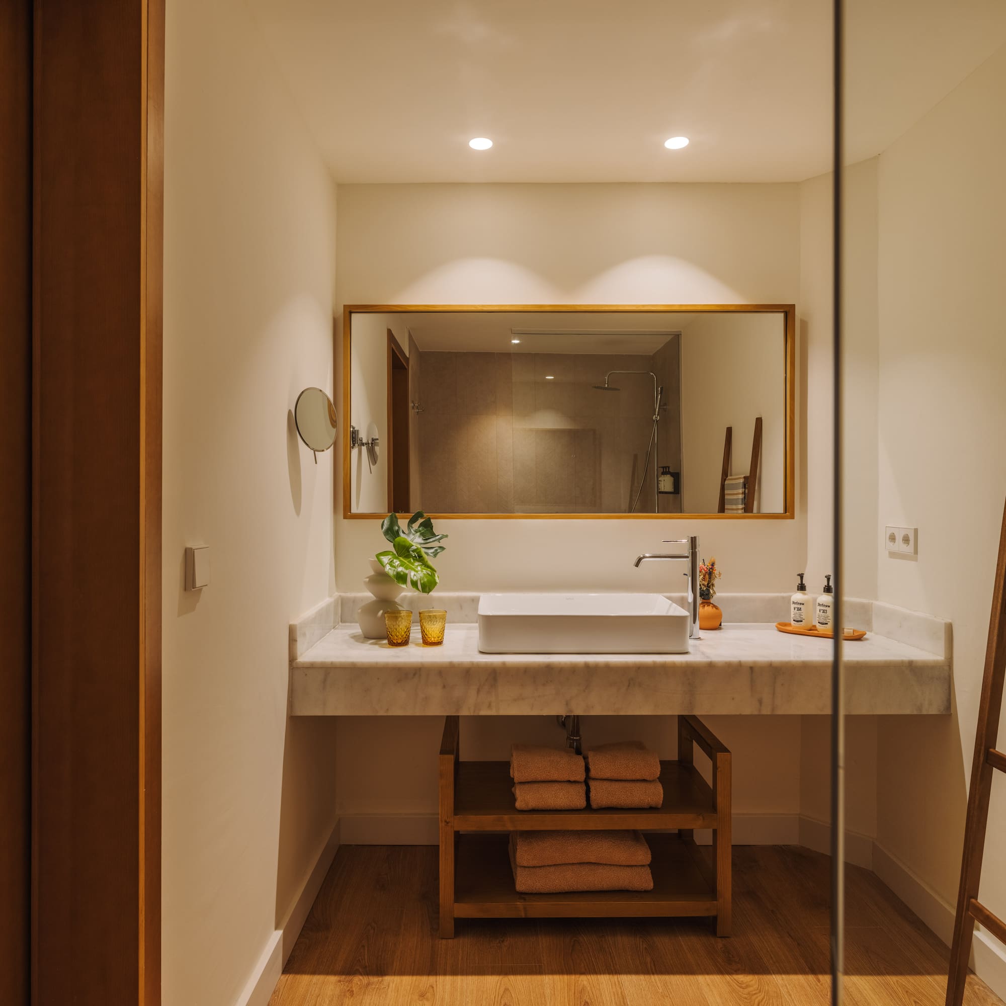 a bathroom with a mirror and sink