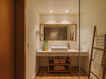 a bathroom with a mirror and sink