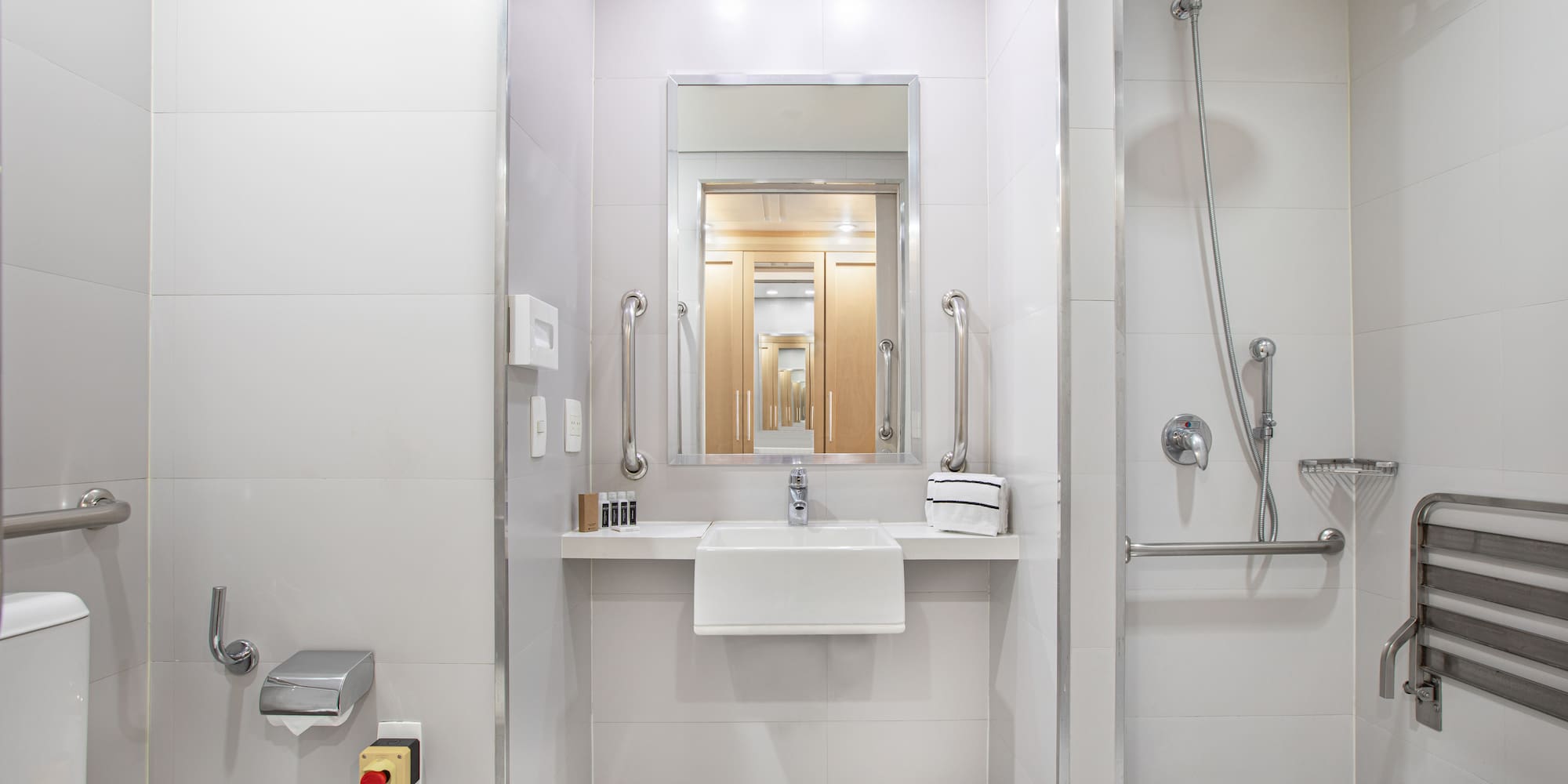 a bathroom with a shower and sink