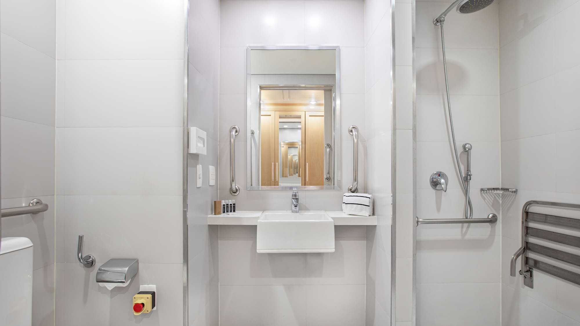 a bathroom with a shower and sink