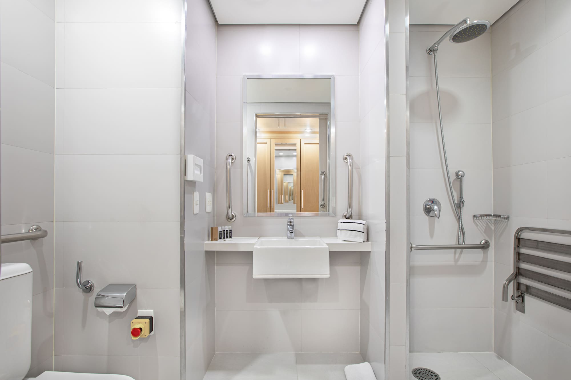 a bathroom with a shower and sink