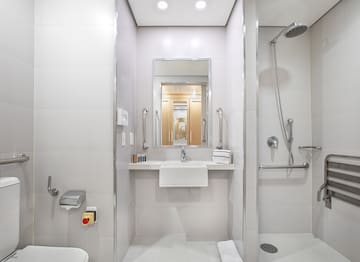 a bathroom with a shower and sink