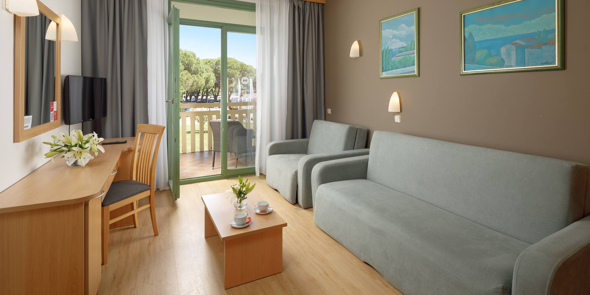 a living room with a table and chairs