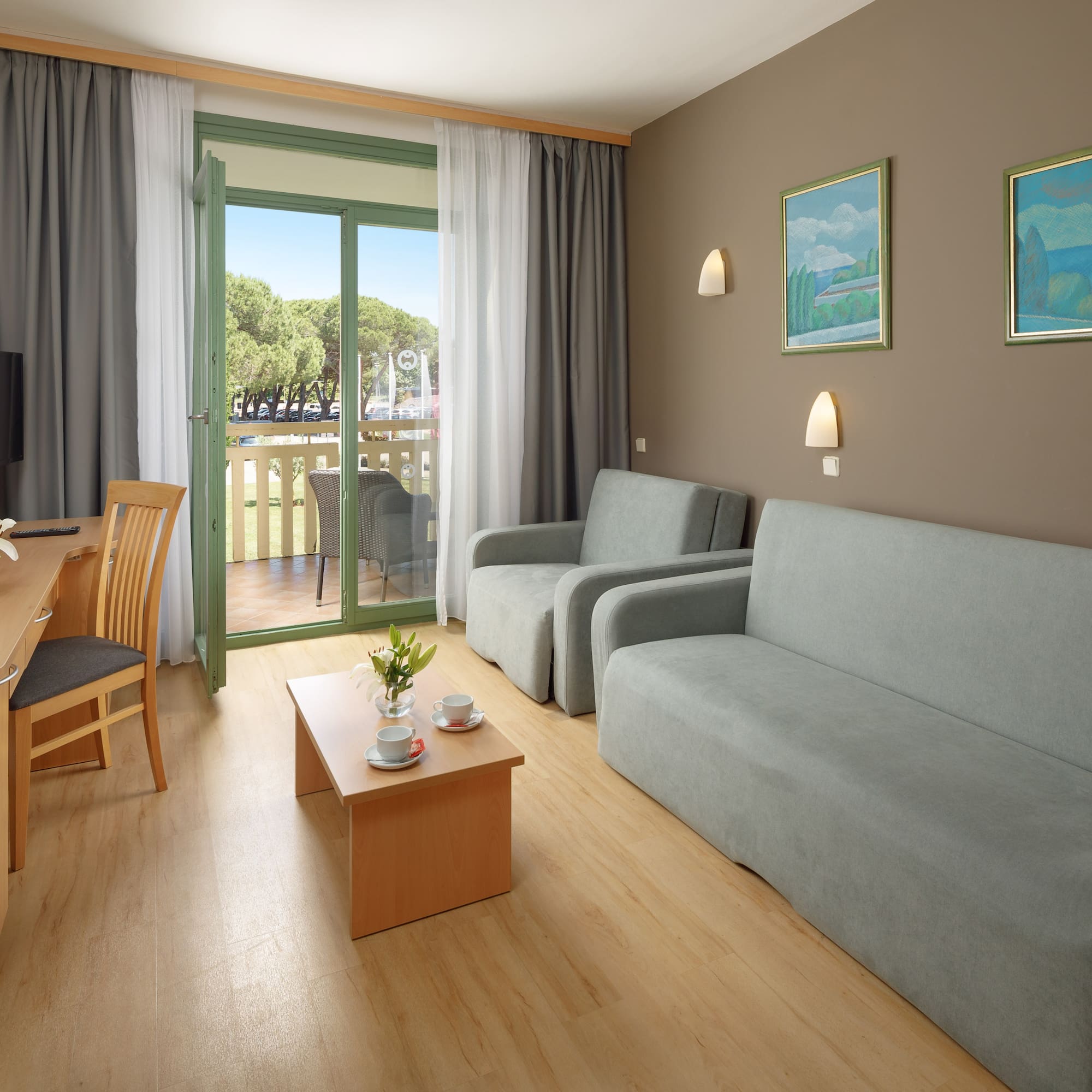 a living room with a table and chairs