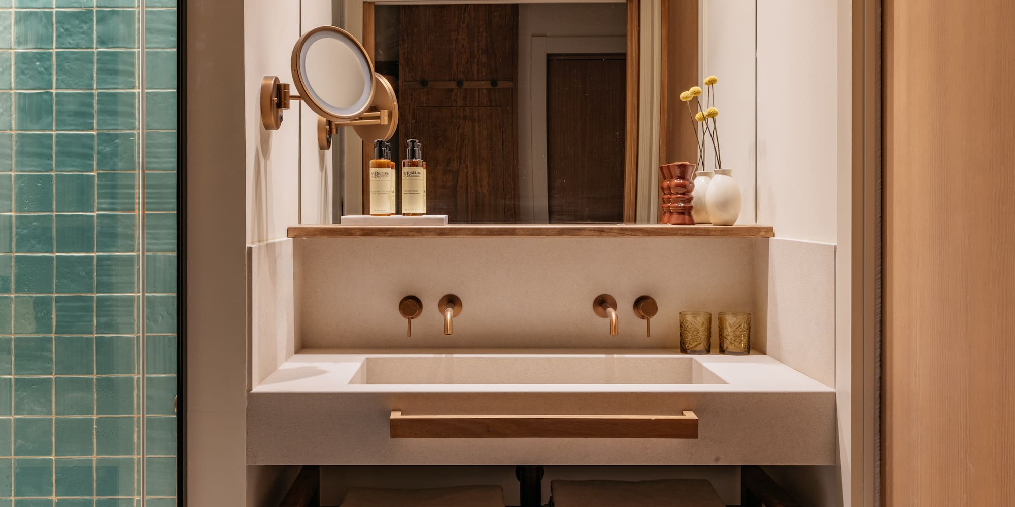 a bathroom with a mirror and sink