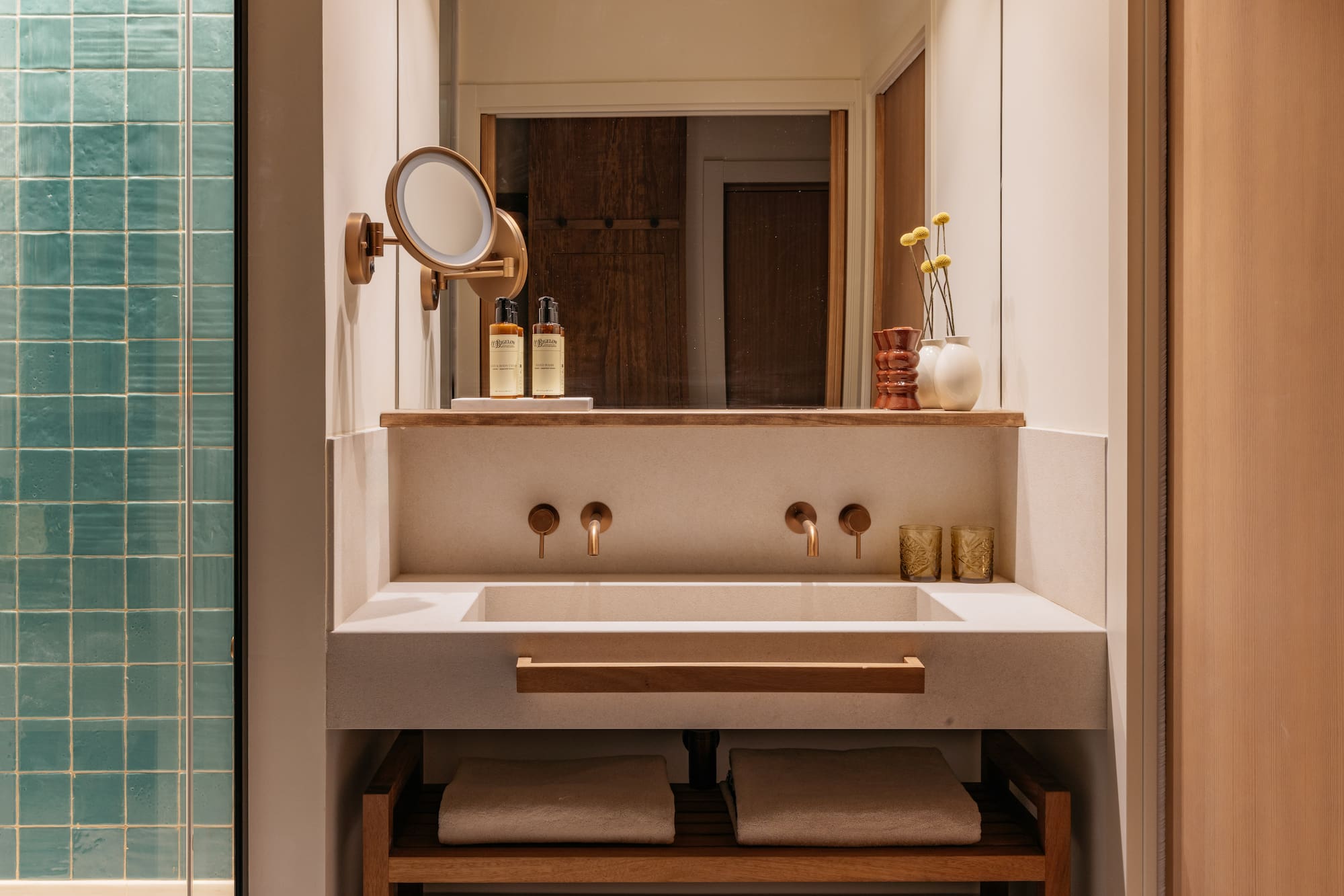 a bathroom with a mirror and sink