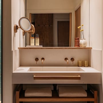 a bathroom with a mirror and sink