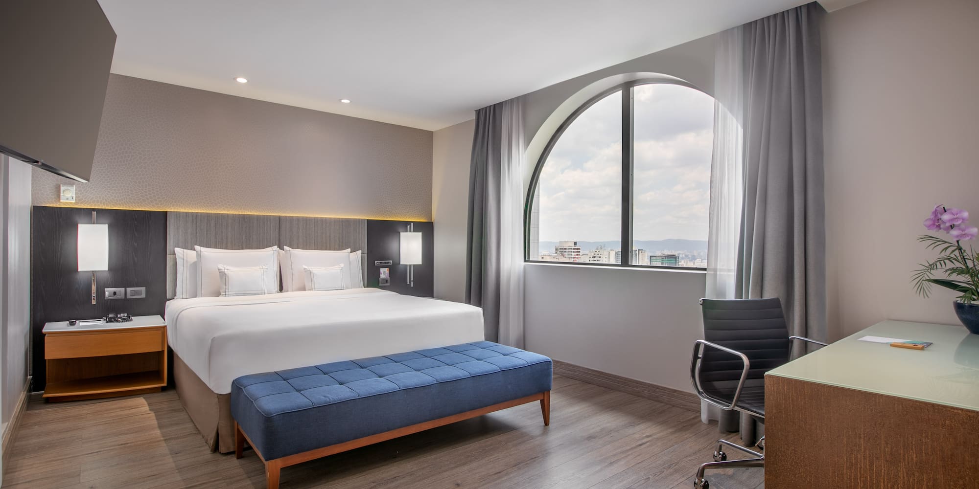 a room with a bed and a desk