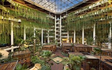 a building with many cages and plants