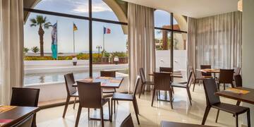 a room with tables and chairs