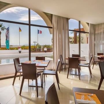 a room with tables and chairs