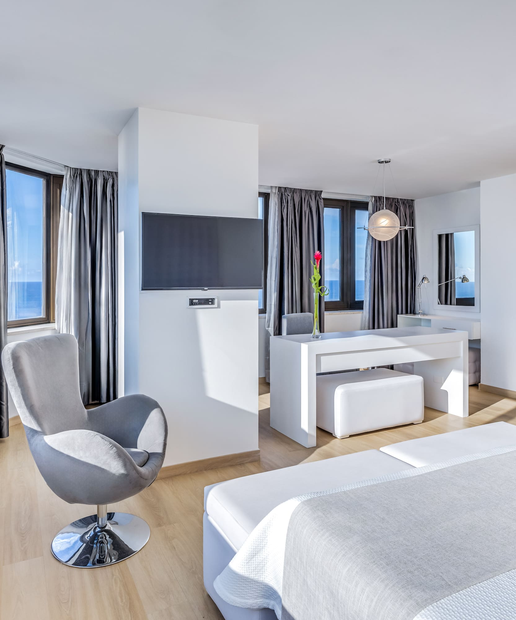 a room with a bed and a chair