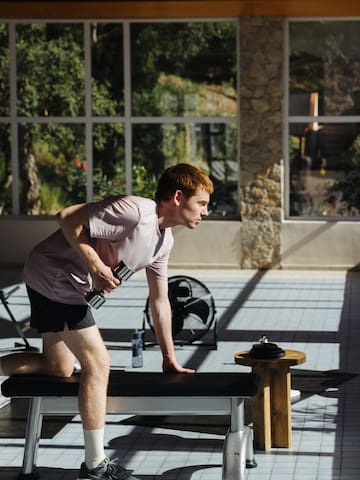 a man lifting weights in a gym