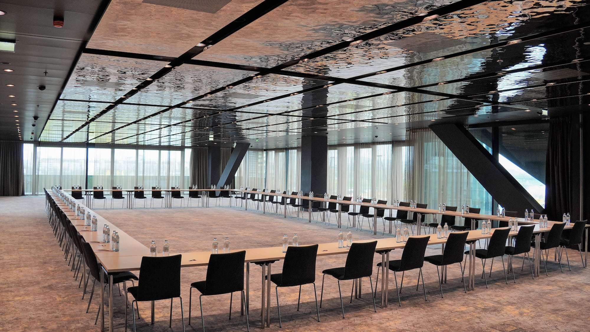 a large conference room with a long table and chairs