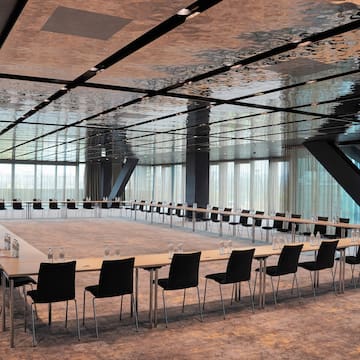 a large conference room with a long table and chairs