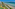 a beach with umbrellas and chairs and trees