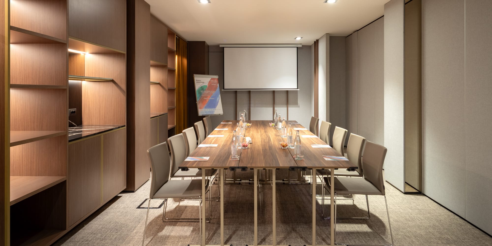 a conference room with a table and chairs
