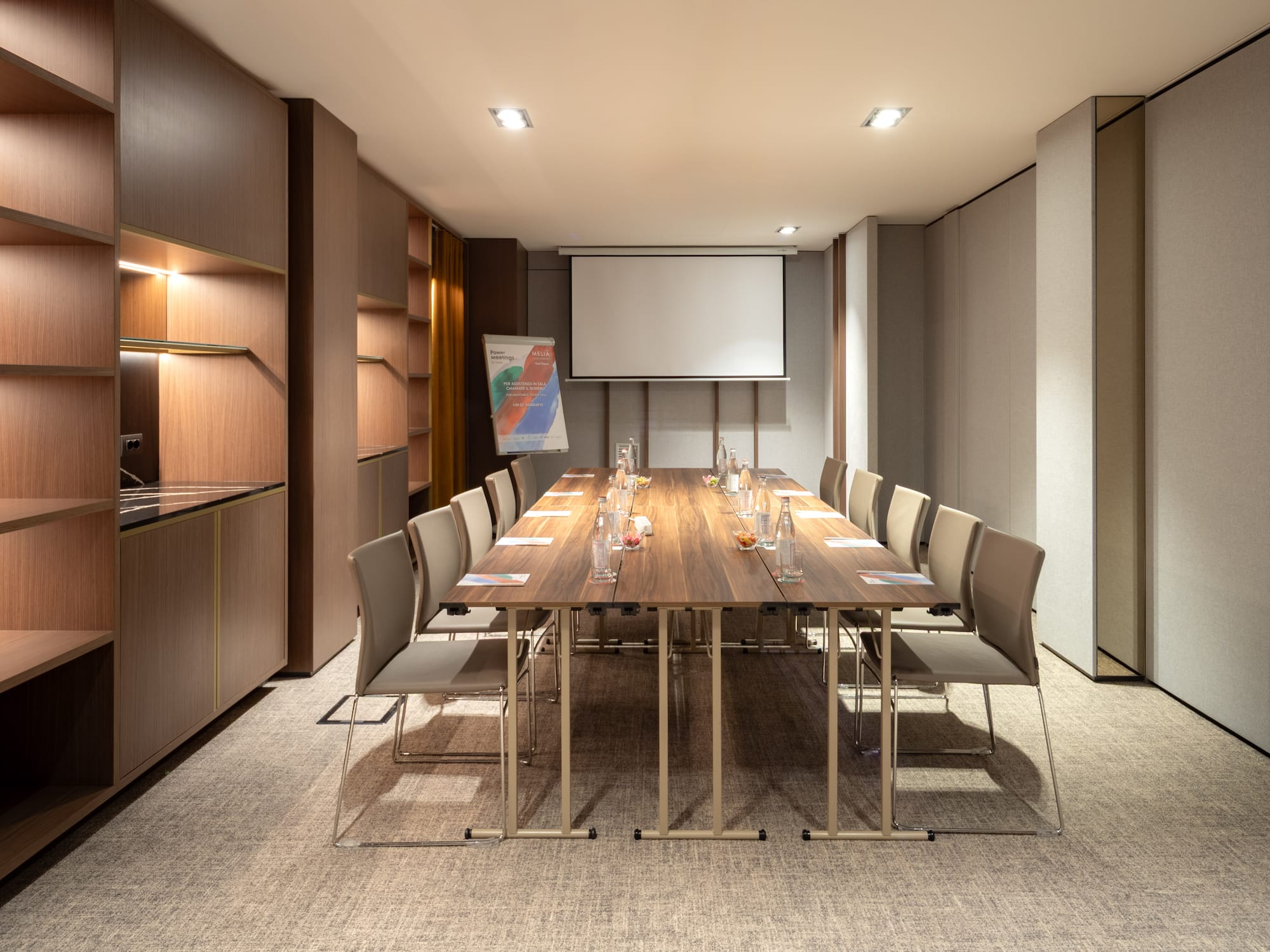 a conference room with a table and chairs