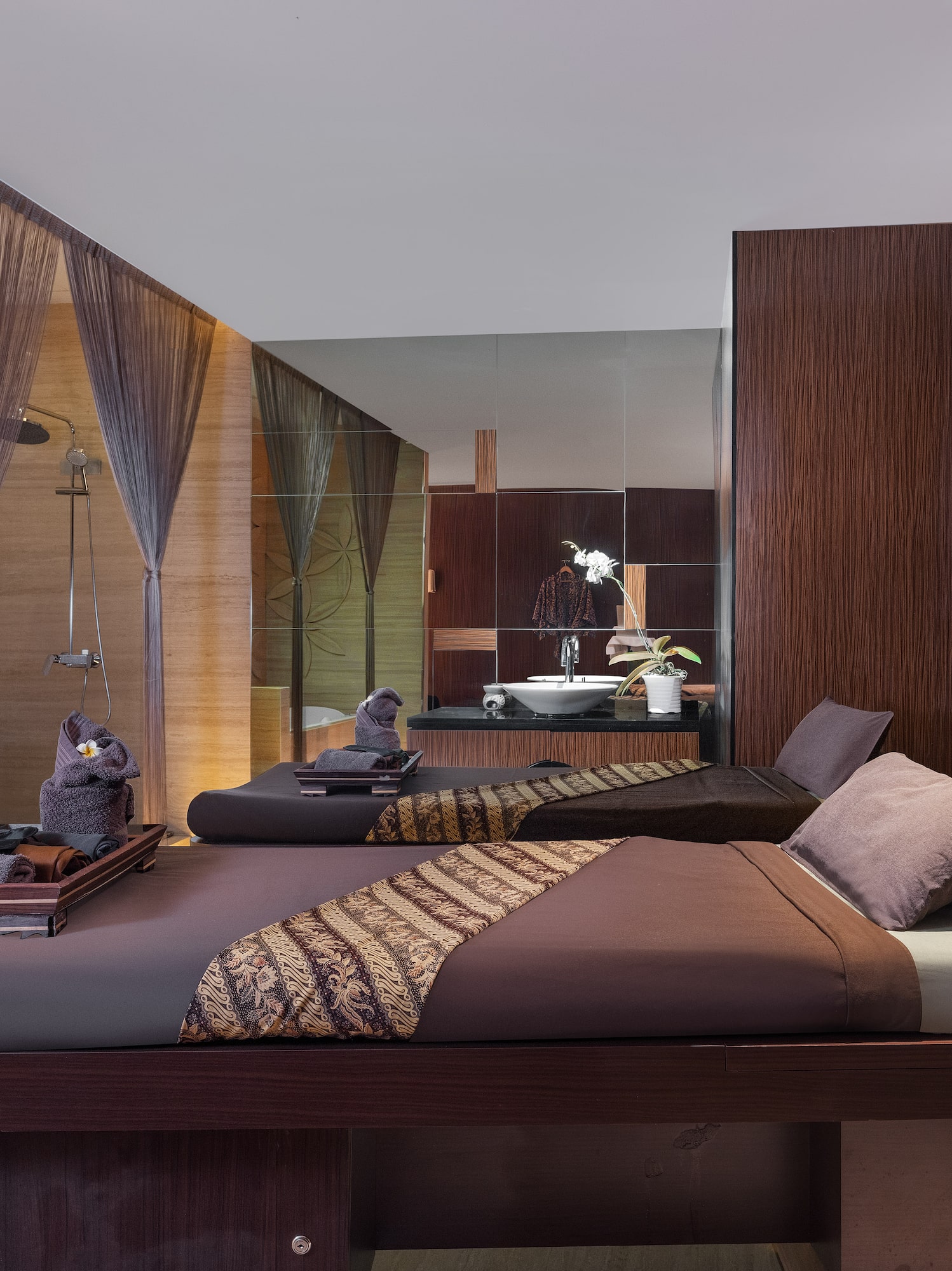 a room with two beds and a shower