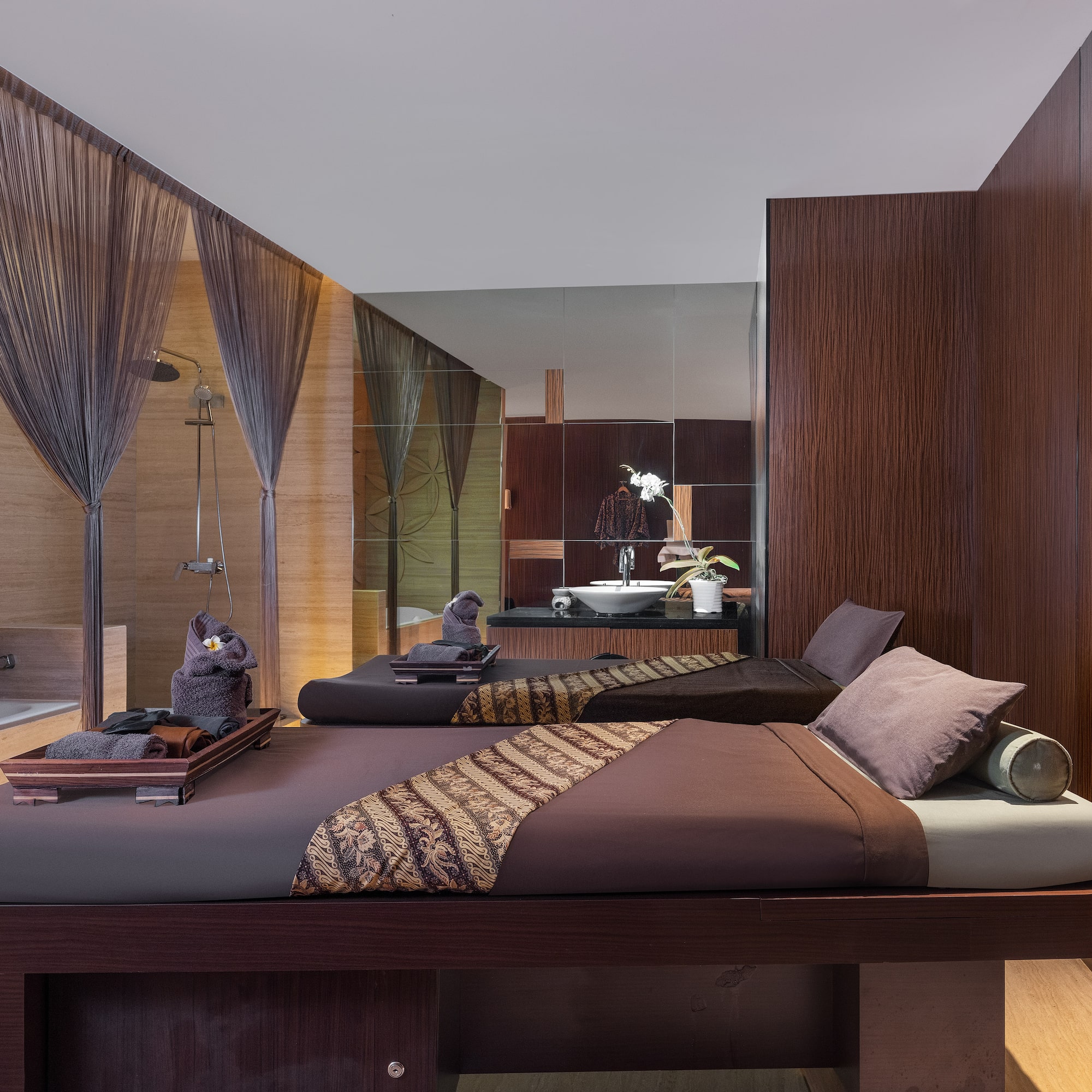 a room with two beds and a shower