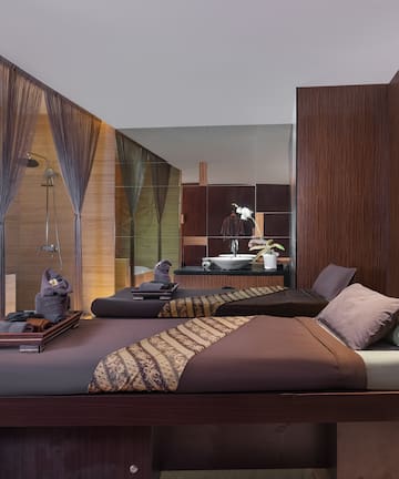 a room with two beds and a shower