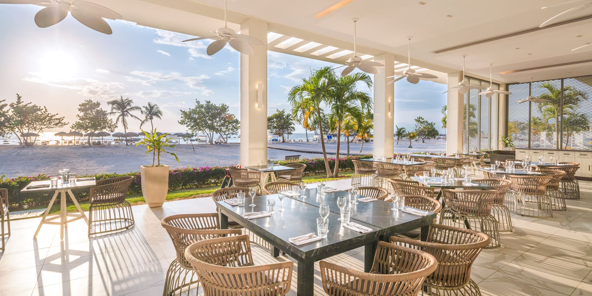 a large outdoor dining area with tables and chairs