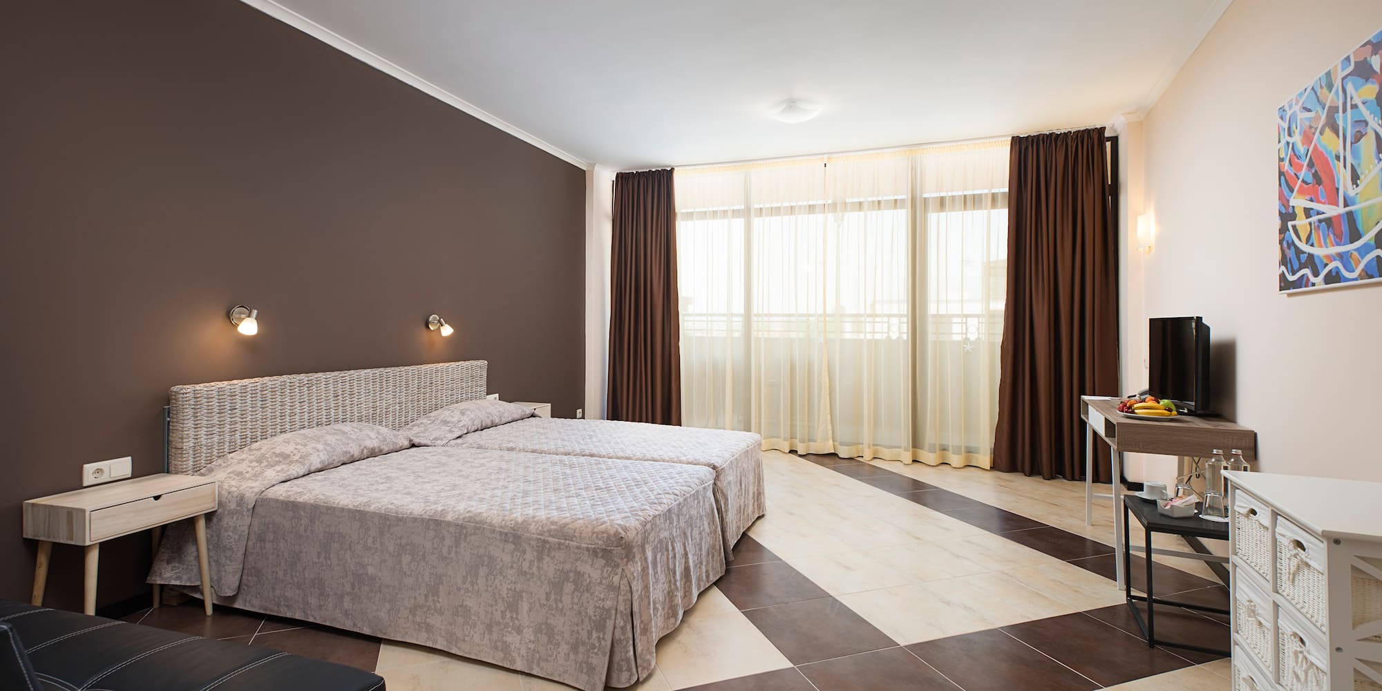 a bedroom with a checkered floor and a desk