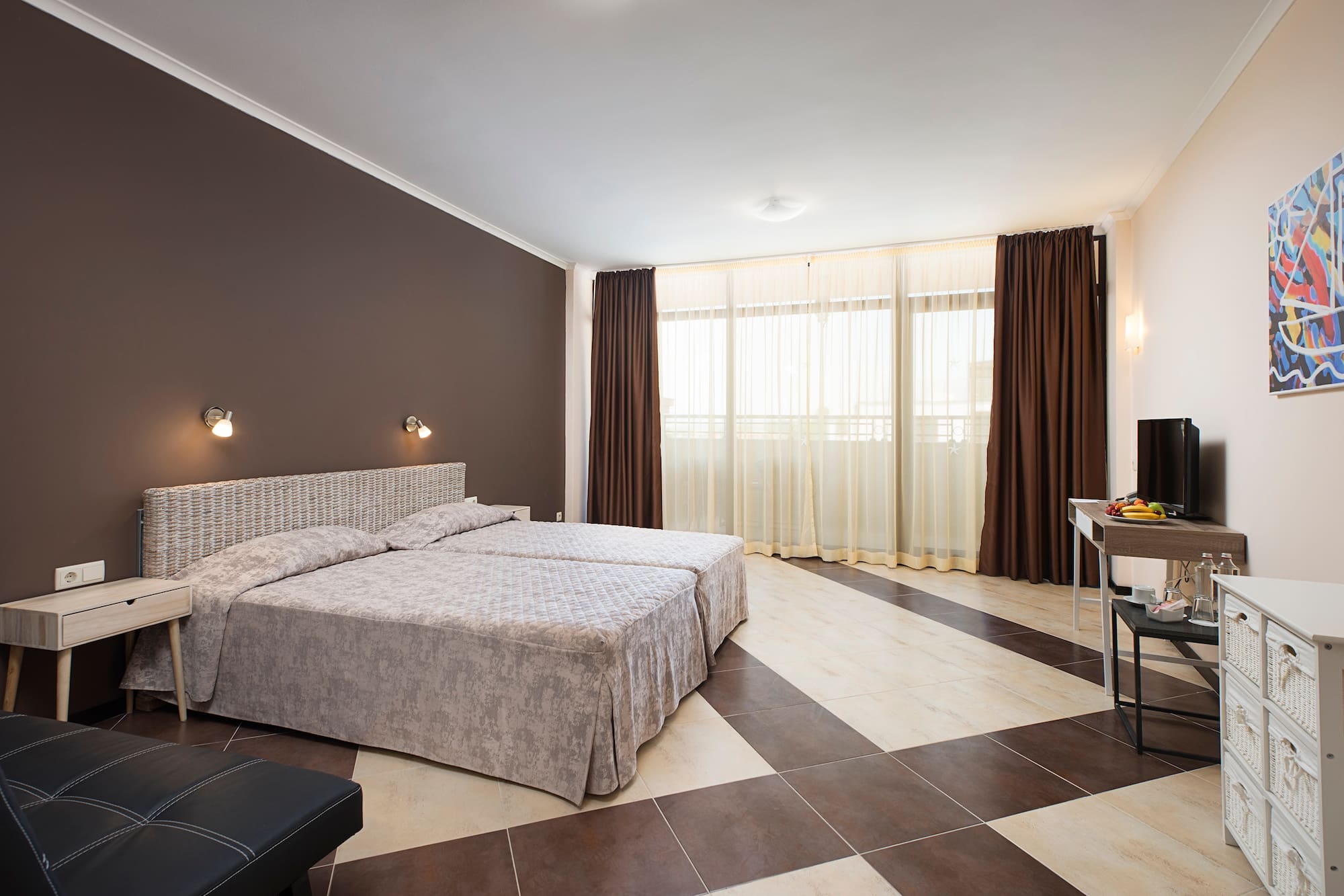 a bedroom with a checkered floor and a desk
