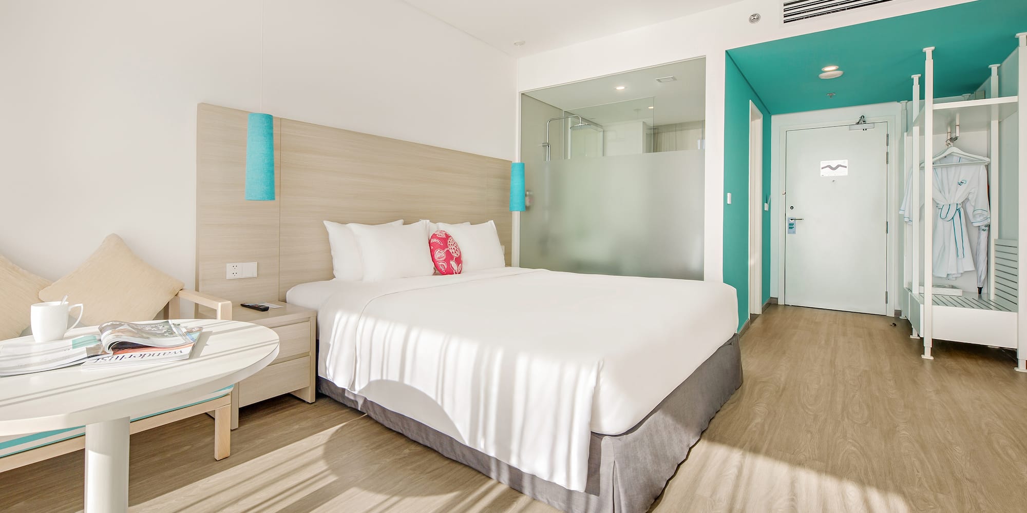 a hotel room with a bed and a table