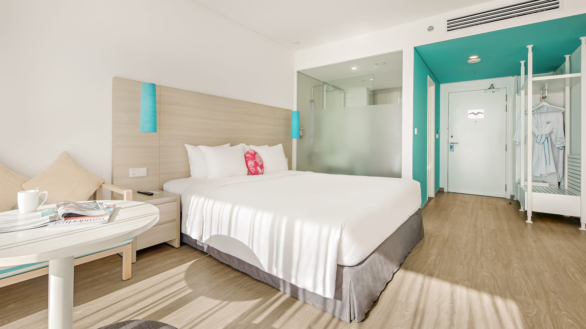 a hotel room with a bed and a table