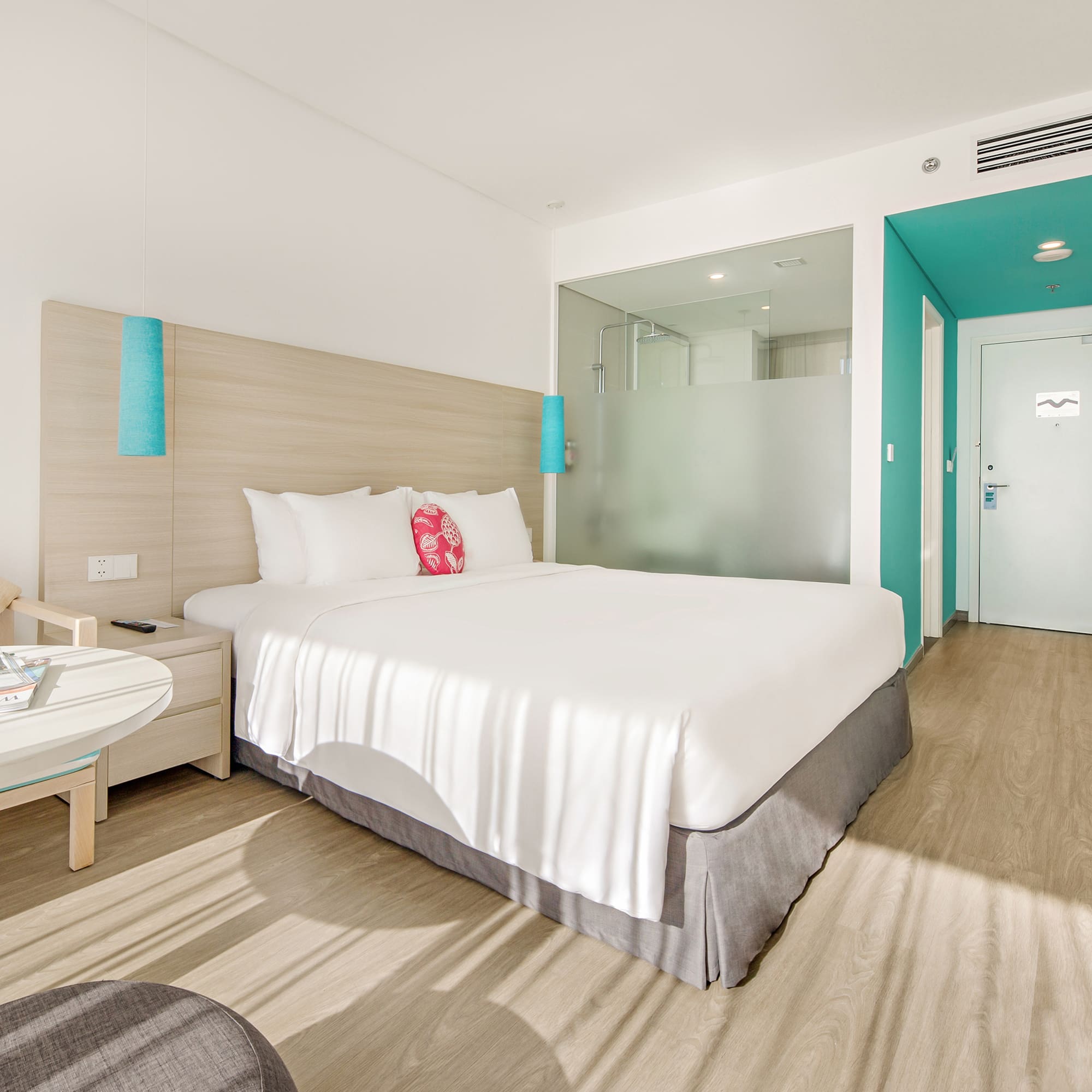 a hotel room with a bed and a table